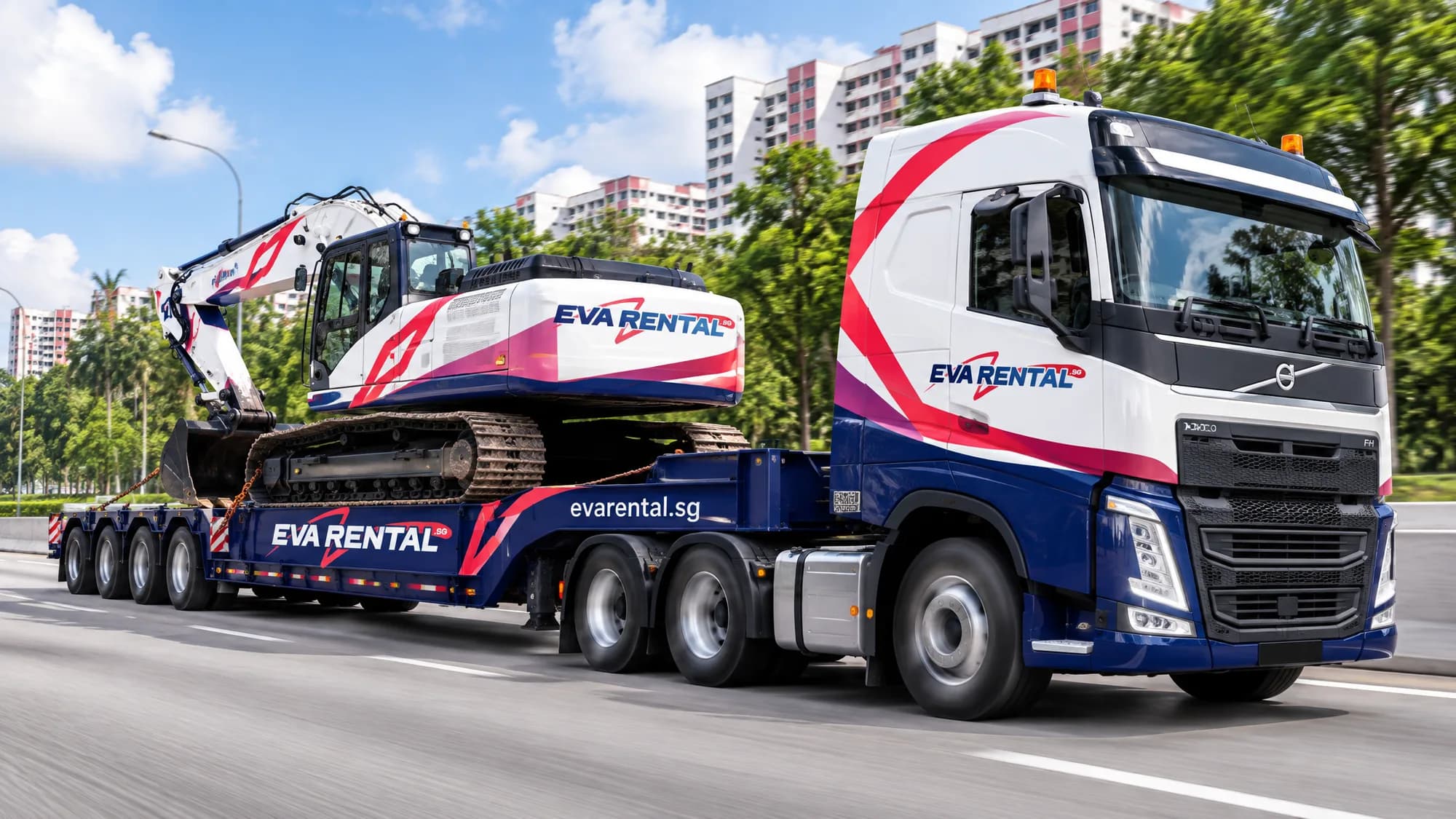 Fleet livery: prime mover and low-bed trailer, on the move.